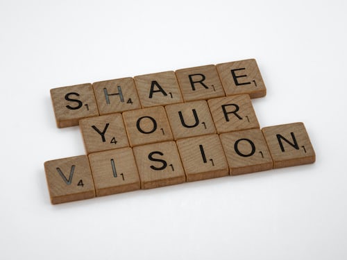 Share your vision spelled out in scrabble pieces against a white background