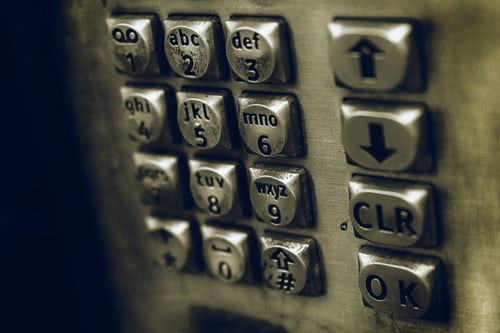 A close up of telephone box dial buttons to symbolise the importance of engaging leads before a warm call