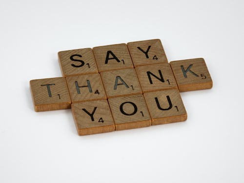 Say thank you spelled out in scrabble pieces