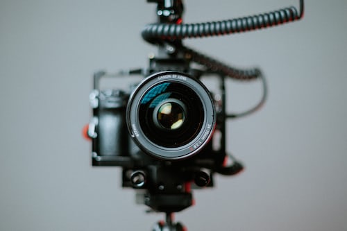 A close image of a Lumix DSLR camera on a stand