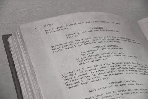 An old fashioned script typed out in a black book