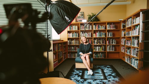 A sales woman being interviewed on camera for supporting sales material