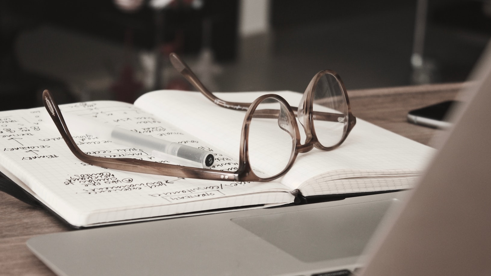 A salesperson's journal with a series of leads marked inside